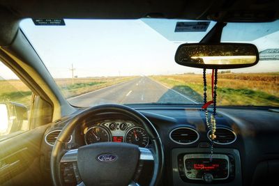 Road seen through car windshield