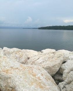 Scenic view of sea and rocks against sky