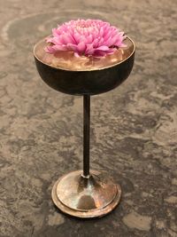 High angle view of pink flower on table