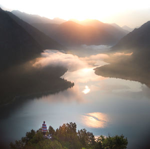 Scenic view of silhouette mountains against sky at sunset