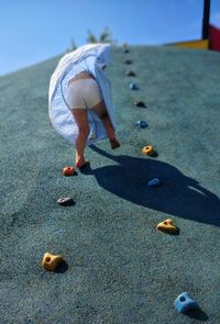 Full length of man playing on sand at beach