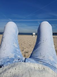 Scenic view of beach against blue sky