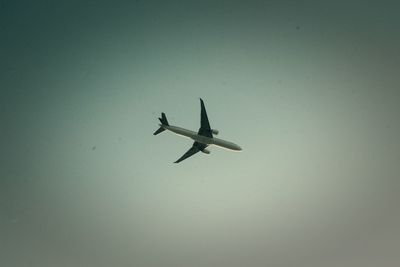 Low angle view of airplane flying in sky