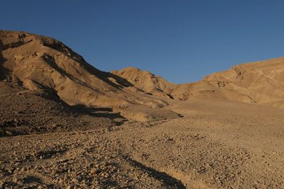 Scenic view of desert against clear sky