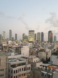 High angle view of buildings in city against sky