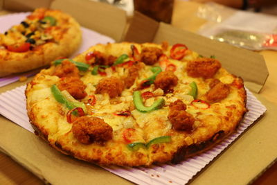 Close-up of served pizza on table