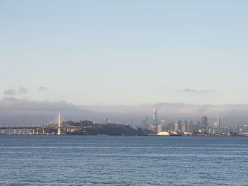 City at waterfront against sky