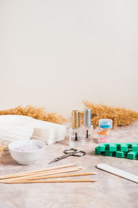 Kitchen utensils on table against white background