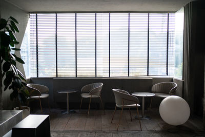 Stylish living room with corner windows with blinds