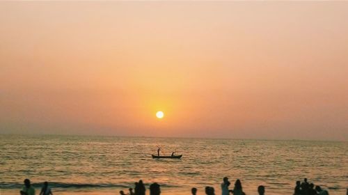 Scenic view of sea against clear sky during sunset