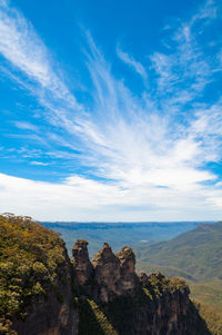 Scenic view of landscape against cloudy sky