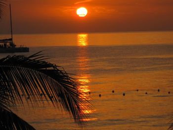 Scenic view of sea against orange sky