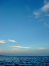 Scenic view of sea against blue sky