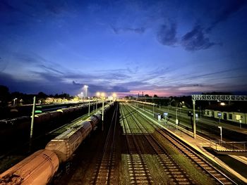 High angle view of railroad tracks against sky at sunset