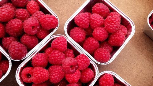 Close-up of raspberries in containers