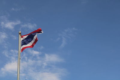 Low angle view of flag against sky