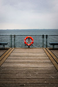 Pier over sea against sky