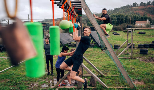 Friends practicing sport on land