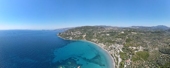 Scenic view of sea against blue sky