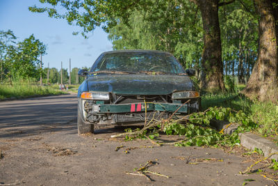 Abandoned car on road