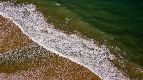 High angle view of waves in sea