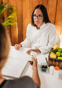 Nutritionist talking with patient at weight loss clinic