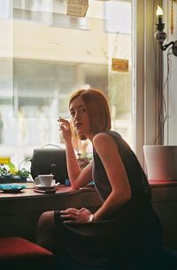 Woman sitting on sofa