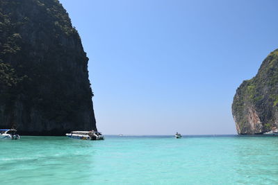 Scenic view of sea against clear blue sky