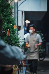 Rear view of people in city