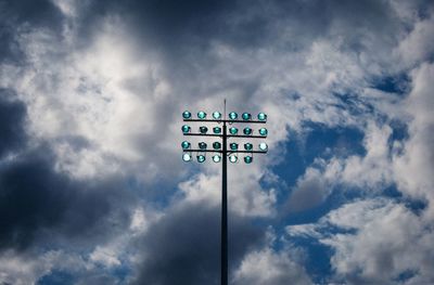 Low angle view of road sign against sky