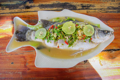 High angle view of fruits in plate on table