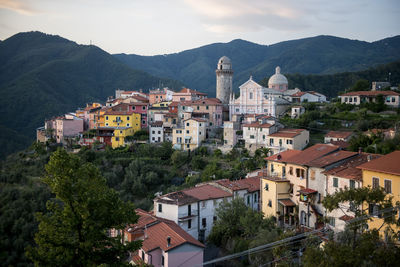 High angle view of townscape and mountains against sky
