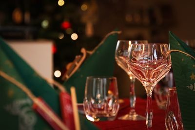 Close-up of wine glasses on table