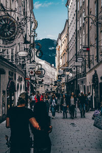 People in city against sky
