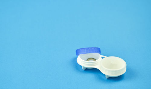 High angle view of blue container against white background