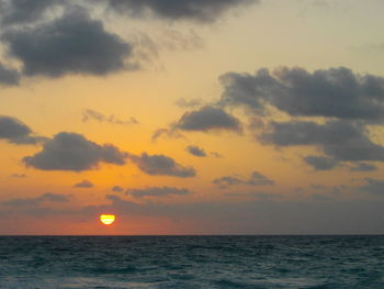 View of calm sea at sunset