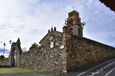 Low angle view of old building against sky