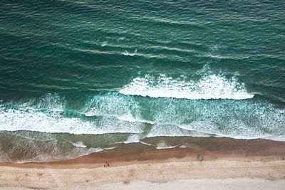 High angle view of surf on beach