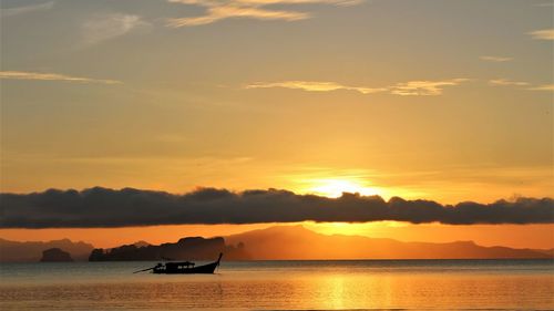 Scenic view of sea against orange sky