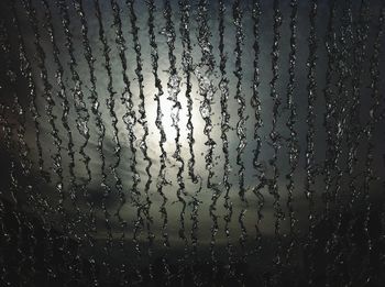 Close-up of water drops on glass
