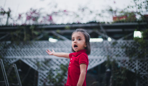Girl standing outdoors