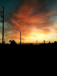 Low angle view of electricity pylon against sky