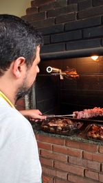 Close-up of man preparing food