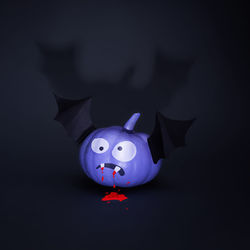 Close-up of toy against black background