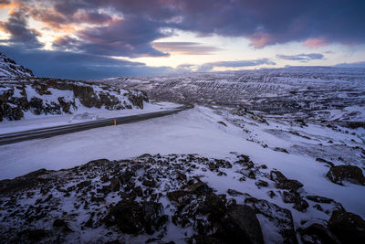 Scenic view of snow covered mountains against sky