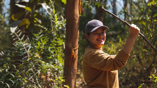 Portrait of smiling woman standing outdoors