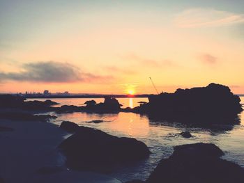 Scenic view of sea at sunset