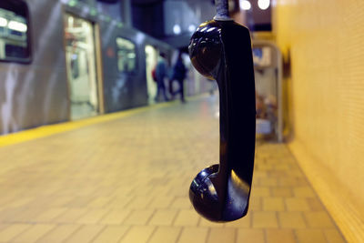 Close-up of illuminated light bulb on table