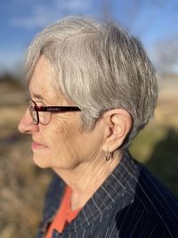 Portrait of woman with arms raised