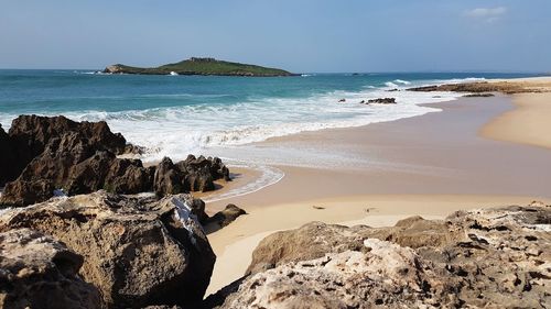 Scenic view of beach against sky